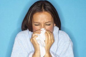 Sick-Young-Woman-Blowing-Her-Nose