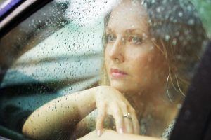 Sad woman and rain.