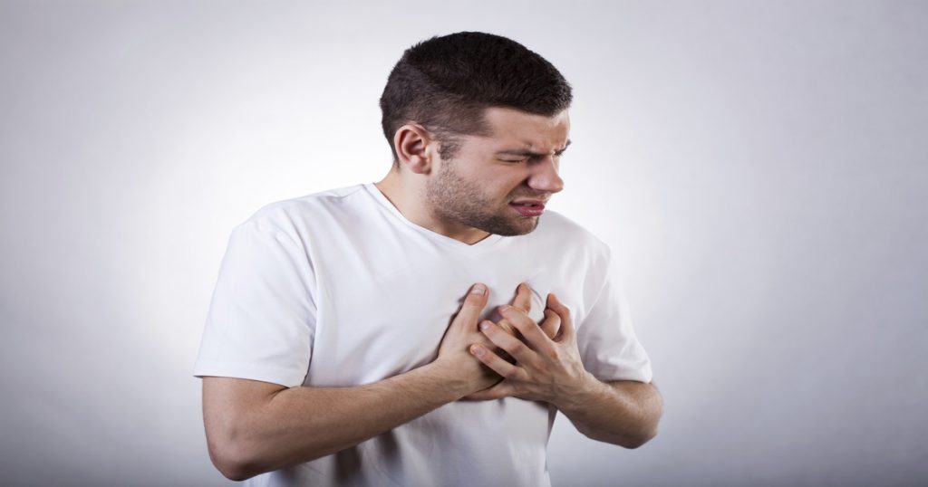 Man suffering the pain of acid reflux